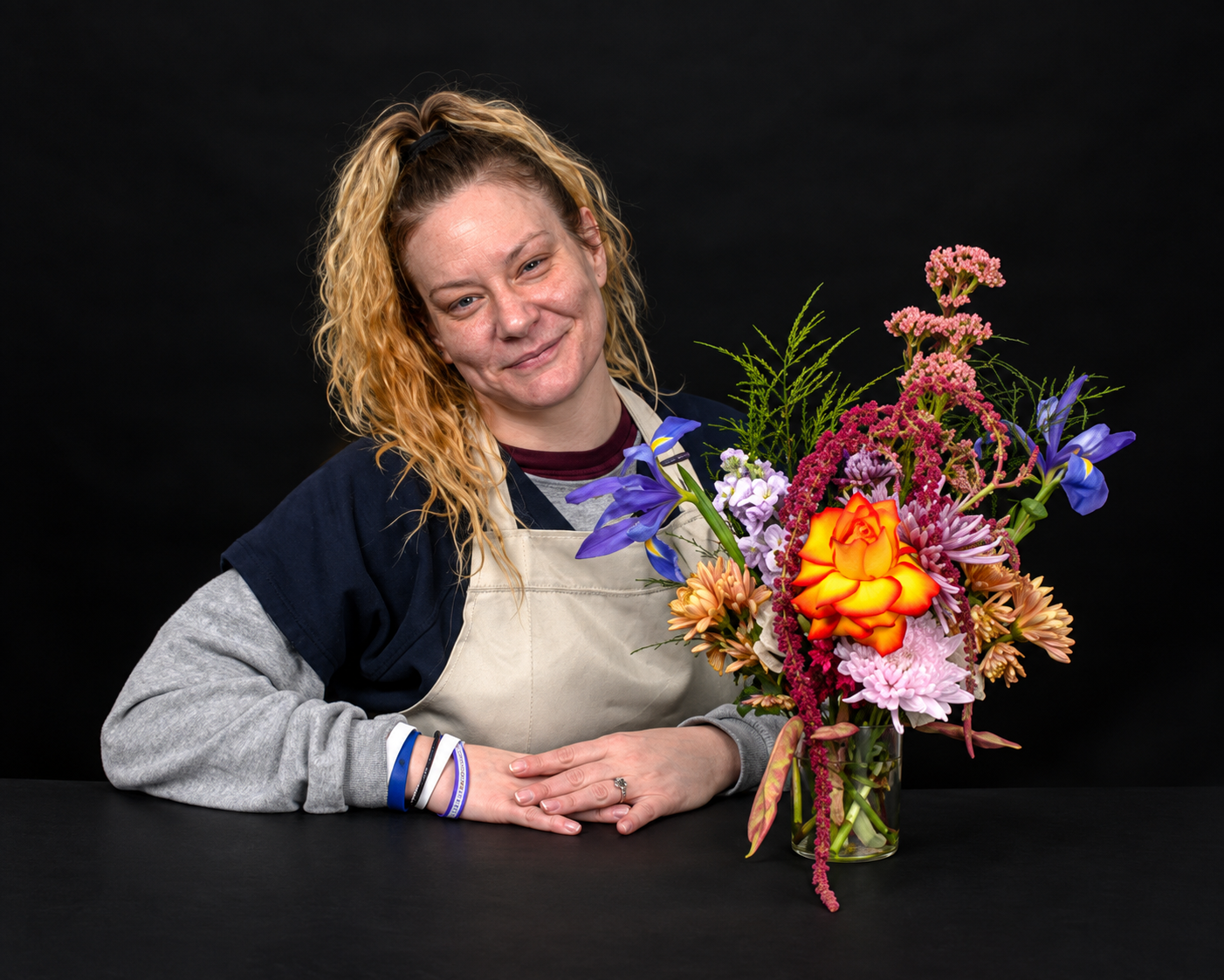 A woman poses with flowers