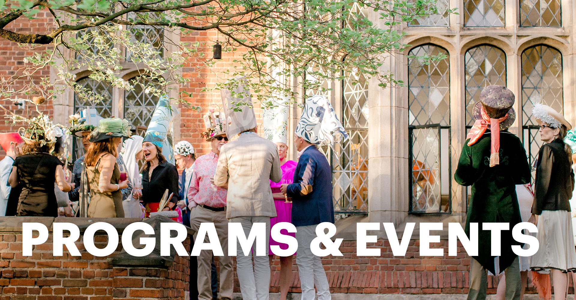 A large group of people socializing in the back courtyard of The Branch with the words "Programs and Events"