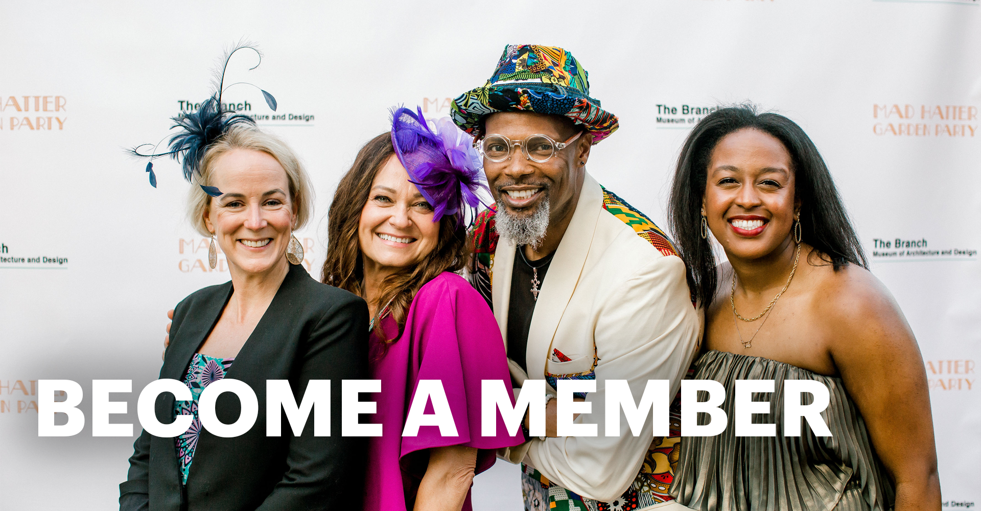 Four people standing together smiling at the camera with the words "Become a Member"
